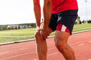Athlete receiving laser therapy treatment to support injury recovery and improve athletic performance