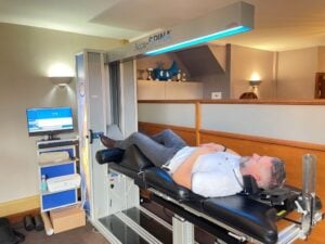 Patient receiving spinal decompression therapy on a specialized treatment table
